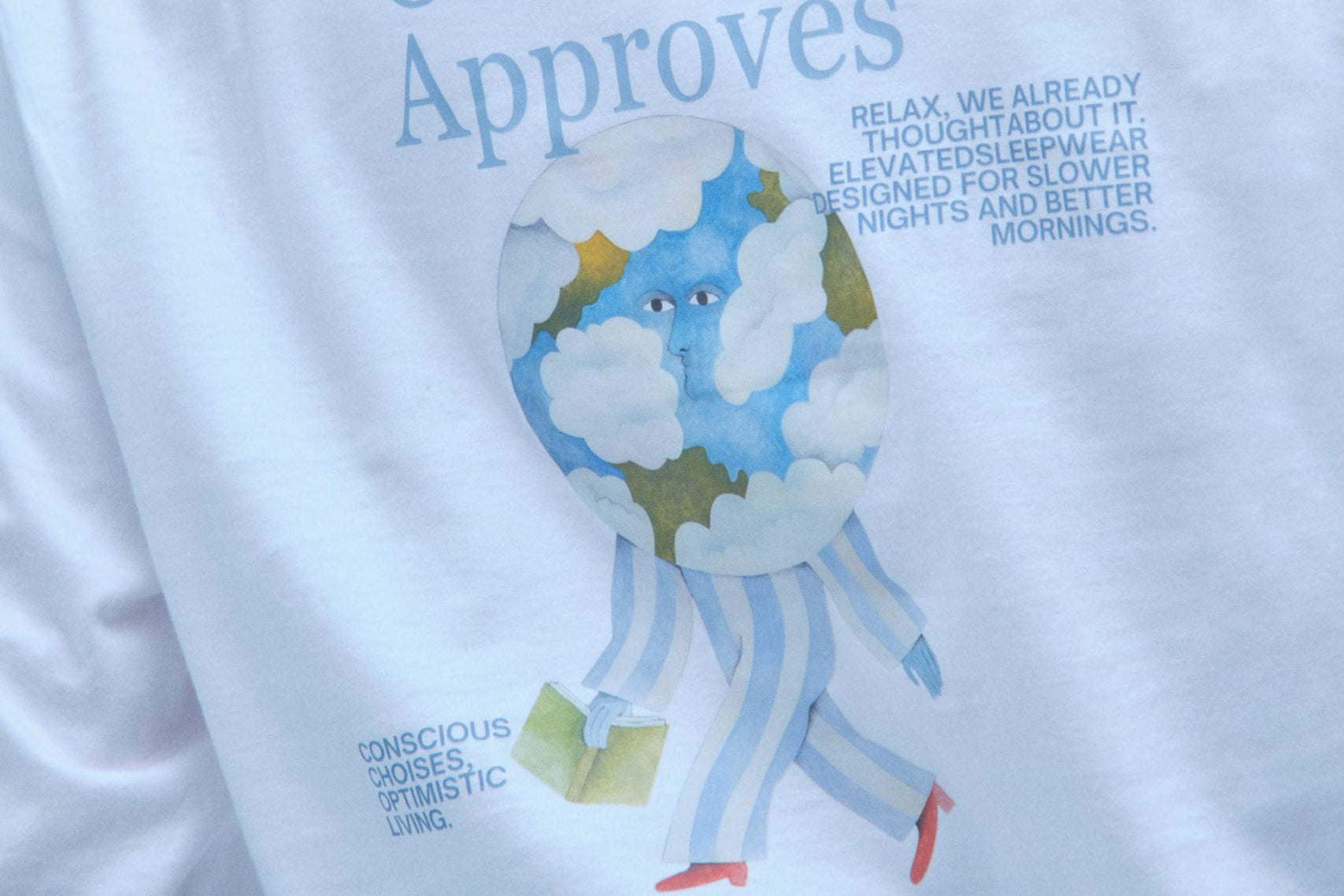 Person wearing a white sweatshirt with a graphic and text on the back, against a light gray background.